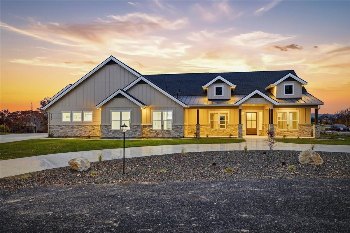 A custom home by Albertson Construction, seen from above at sunset