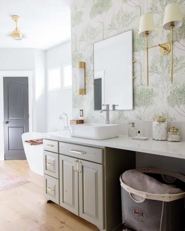 Powder room with a vessel sink and patterned wallpaper
