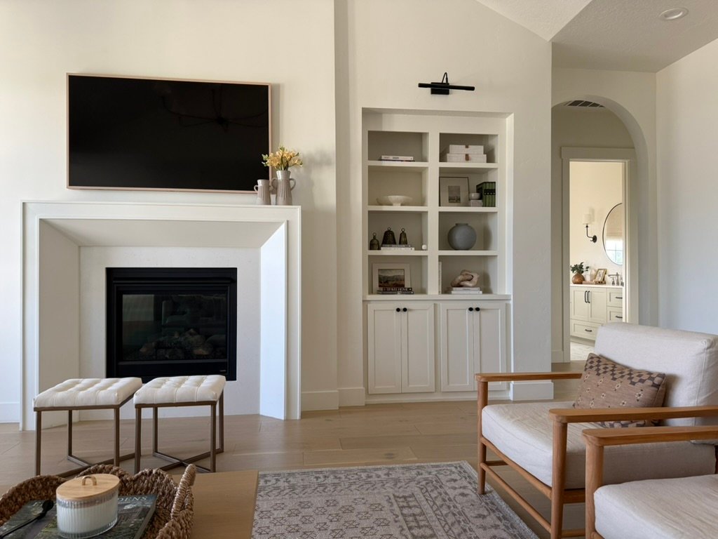 Custom home living room with built-in shelving and fireplace